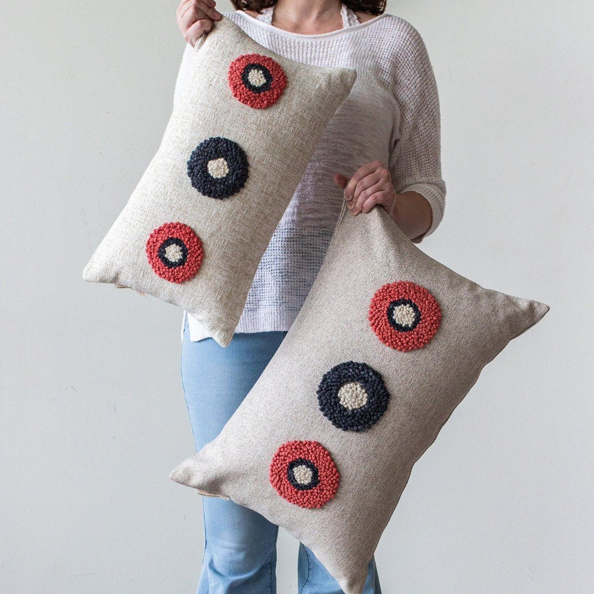 AfriScandi Circles Pillow kanju Interiors African décor handmade natural organic color accent pillow cushion throw decorative lounge comfortable comfy unique modern contemporary stylish soft accent durable minimal couch chair bed handmade luxury thick plush yarn texture punch needle knitting simplicity original embroidered South Africa quality cotton cream black white tangerine