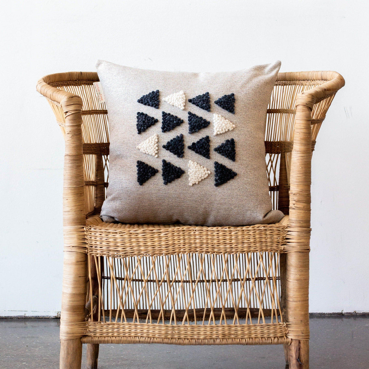 AfriScandi Harvest Pillow kanju interiors African décor handmade natural organic color accent pillow cushion throw decorative lounge comfortable comfy unique modern contemporary stylish soft accent durable minimal couch chair bed handmade luxury thick plush yarn texture punch needle knitting simplicity original embroidered South Africa quality cotton cream black white triangles geometric