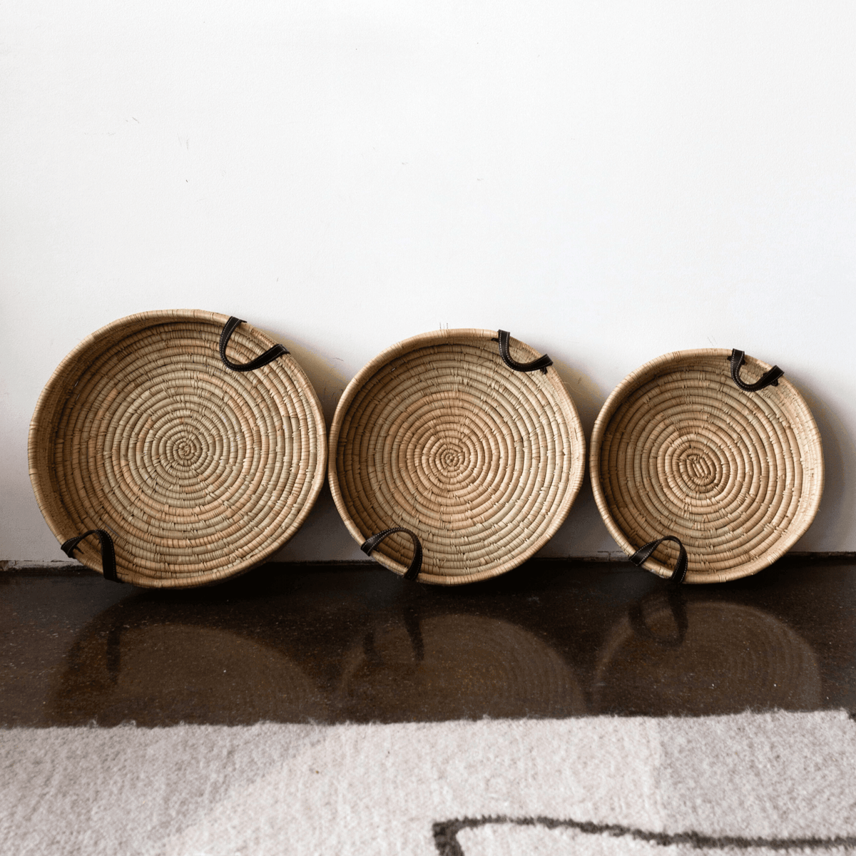 Betty Tray kanju interiors luxury vintage chic bar entertaining tray serving accent table ottoman intricate wood leather handles multifunctional functional function durable indoor outdoor handwoven basket ilala palm natural cocoa black toffee coiled organic centerpiece bowl wall decor shelf decor decorative accent hand made catch-all Zimbabwe platter canape nesting nested