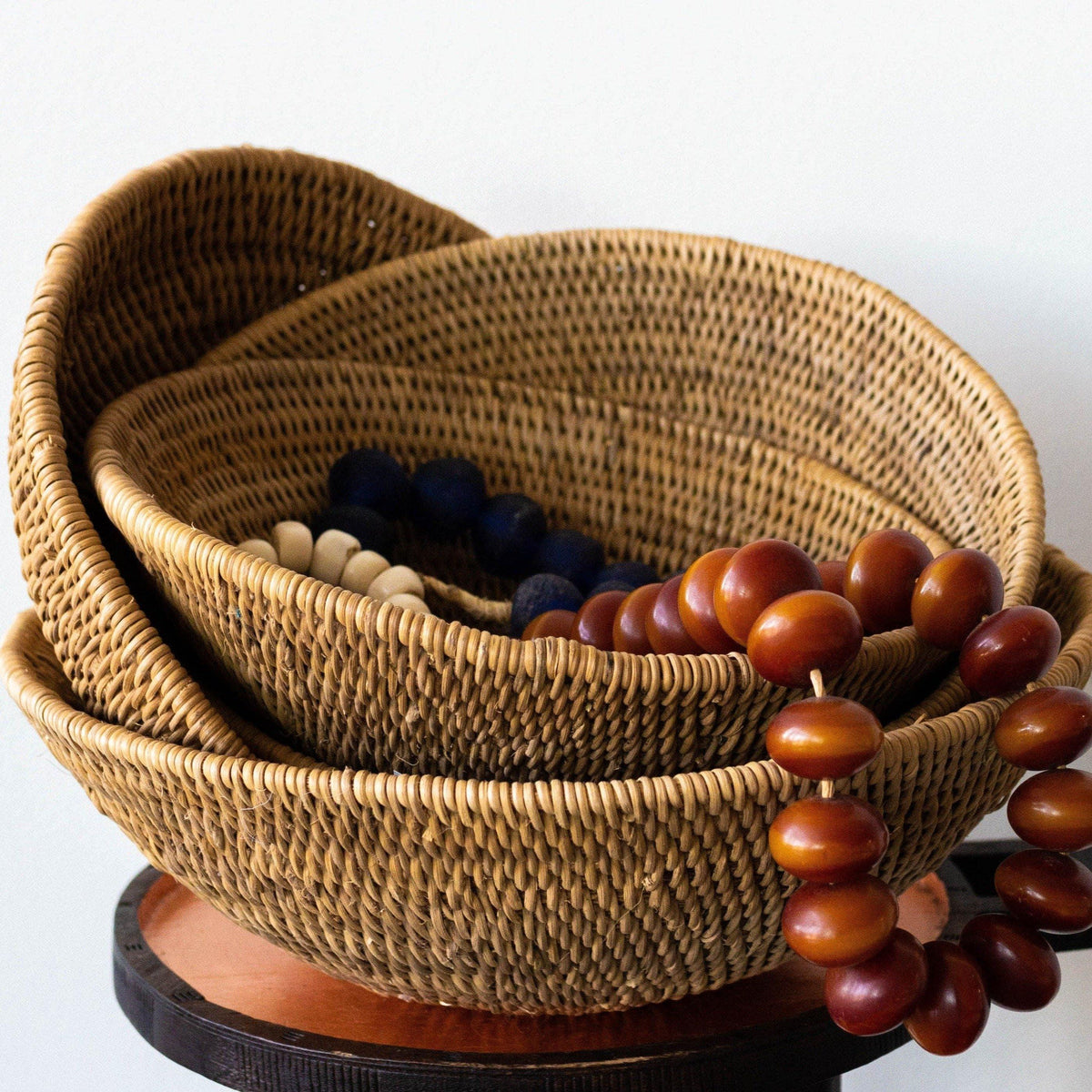 Buhera Harvest Bowls Nesting kanju interiors Intricate handwoven basket artisan natural centerpiece bowl wall décor shelf décor natural decorative accent hand made catch-all pattern geometric Firm durable cane sturdy customizable custom sizes metallic stripes indoor outdoor stylish storage bowl basket vessel catch all functional 