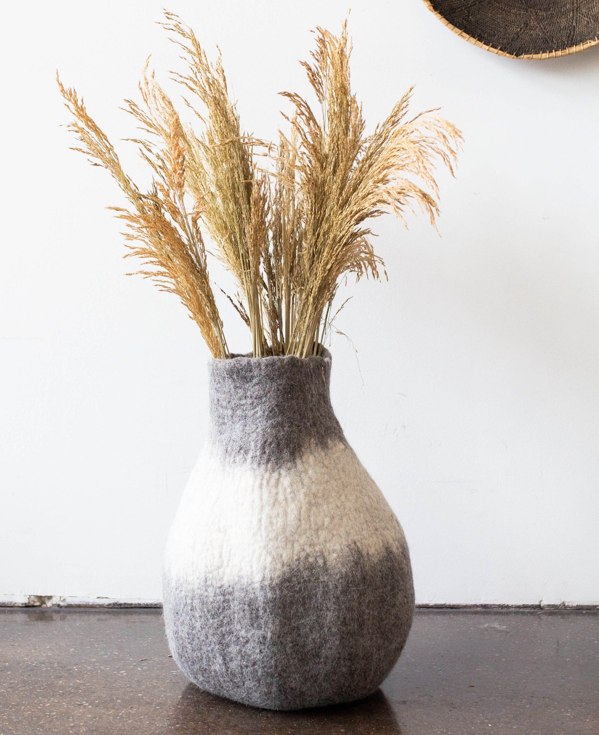 Eclipse Gourd kanju interiors floor table shelf organic unique modern contemporary stylish minimal luxury home goods gift hand felted felt hand dyed karakul wool South Africa functional décor decorative decoration texture soft durable washable collapsible ombre gourd basket small large charcoal gray natural white storage planter