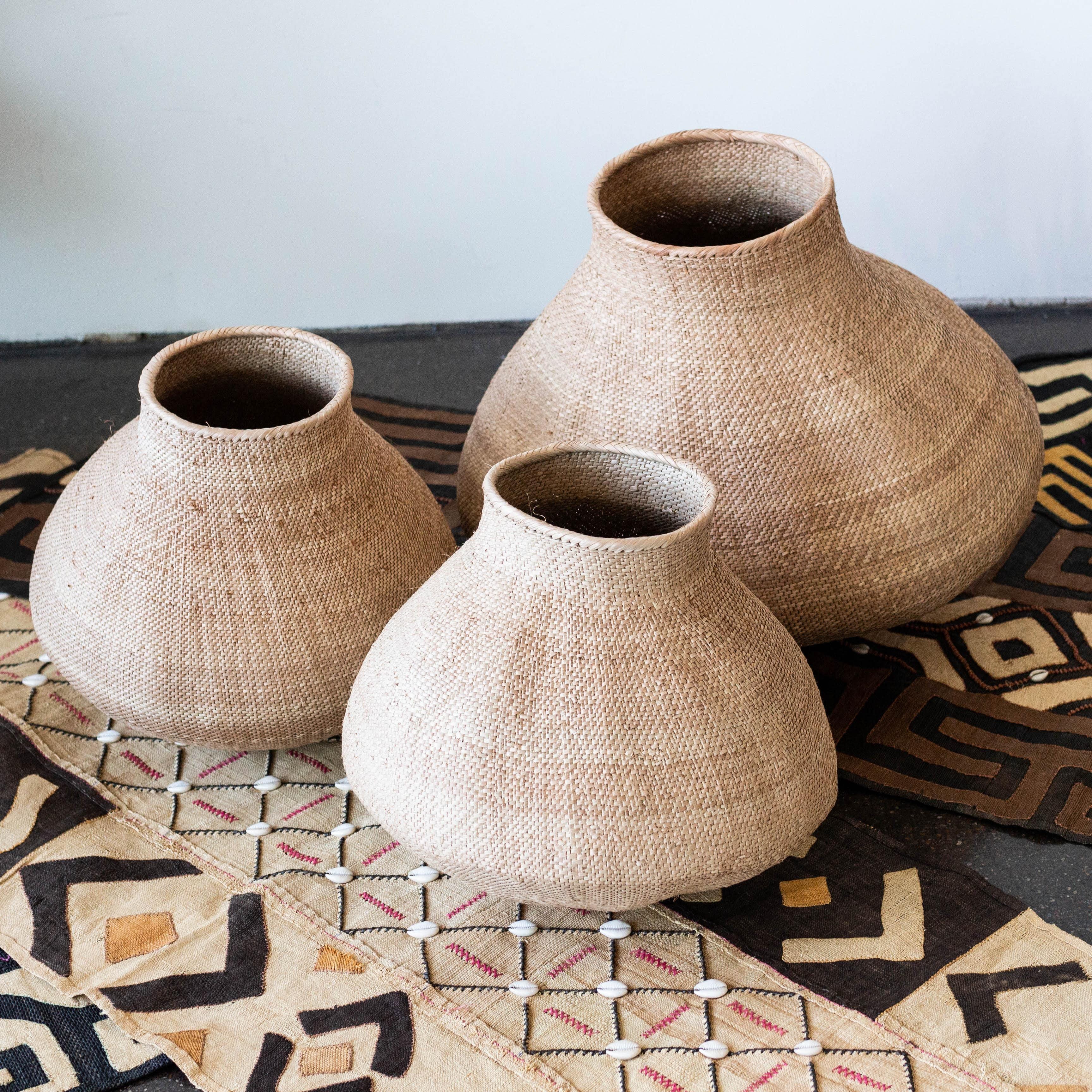 kanju interiors giant nongo basket hand woven grass weave pot shaped organic palm leaves vines traditional simple geometric unique gift decor decorative planter vessel storage