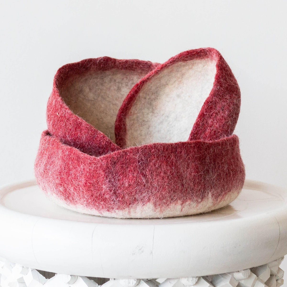 Hand Felted Nesting Bowls kanju interiors organic unique modern contemporary stylish minimal luxury home goods gift hand felted felt hand dyed karakul wool South Africa functional décor decorative decoration texture soft durable washable collapsible  nesting catch all set of three ombre berry tangerine orange marigold yellow natural white storage small medium large flower plant succulent home office dining bedroom living room shelf table texture 