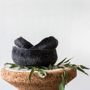 Hand Felted Nesting Bowls kanju interiors organic unique modern contemporary stylish minimal luxury home goods gift hand felted felt hand dyed karakul wool South Africa functional décor decorative decoration texture soft durable washable collapsible  nesting catch all set of three charcoal natural white storage small medium large flower plant succulent home office dining bedroom living room shelf table texture 