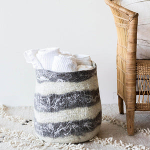 Ingobozi Basket kanju interiors organic unique modern contemporary stylish minimal luxury home goods gift hand felted felt hand dyed karakul wool South Africa functional décor decorative decoration texture soft durable washable collapsible Storage planter gray white natural merino wool living room bedroom kids room laundry basket handles versatile modern