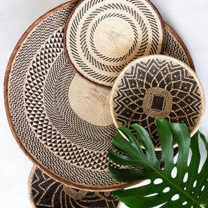 Binga Patterned Flat Baskets kanju interiors function hand woven natural grasses one of a kind unique rustic imperfect table top decor wall decor mounted organic natural fine weave baskets trays shallow bowls Zimbabwe ilala palm cream flat basket accent intricate artisan catch-all geometric pattern cocoa